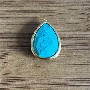 Turquoise Teardrop Pendant set in gold metal